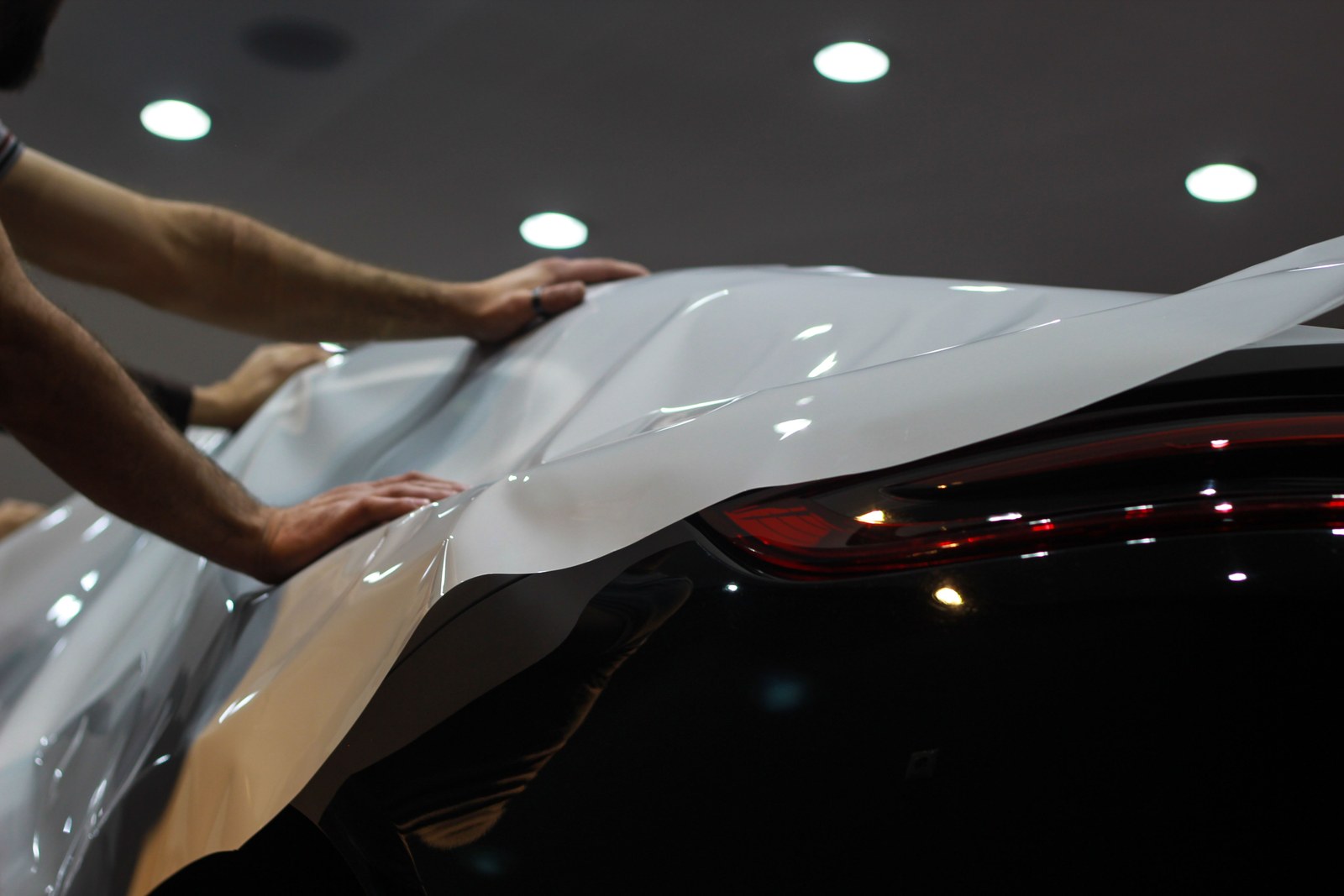 Paint protection film being applied to a car panel
