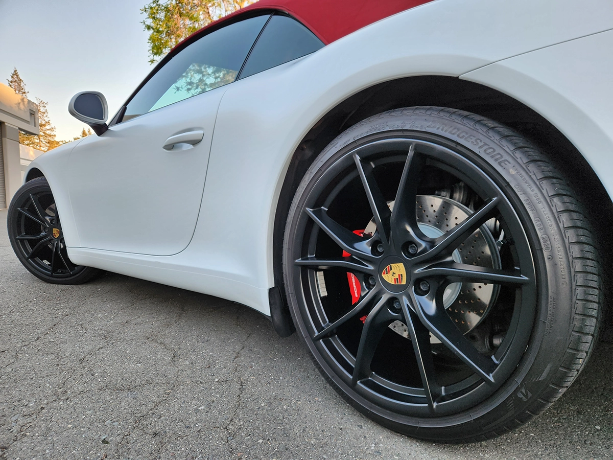Vehicle with a satin paint protection film finish