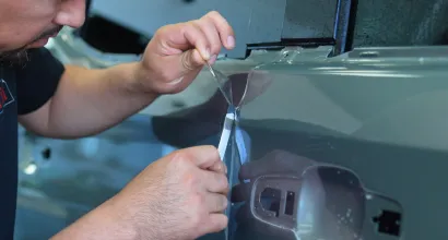 Paint protection film being installed at Mr. Tint PPF & Coatings